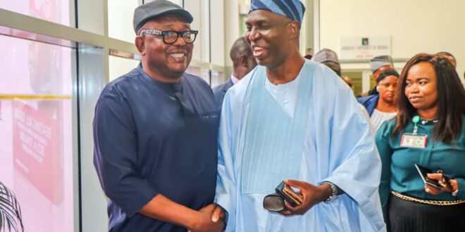 Chairman, Editorial Board of The Nation Newspapers, Mr. Sam Omatseye and Delta Dr. Ifeanyi Osuoza, Commissioner for Information, during the book launch